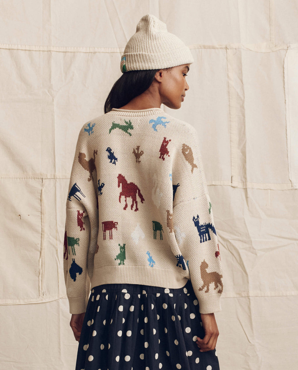 The Pictograph Roll Neck Pullover. -- Cream