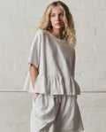 The Oversized Ruffle Peplum Tee. -- True White