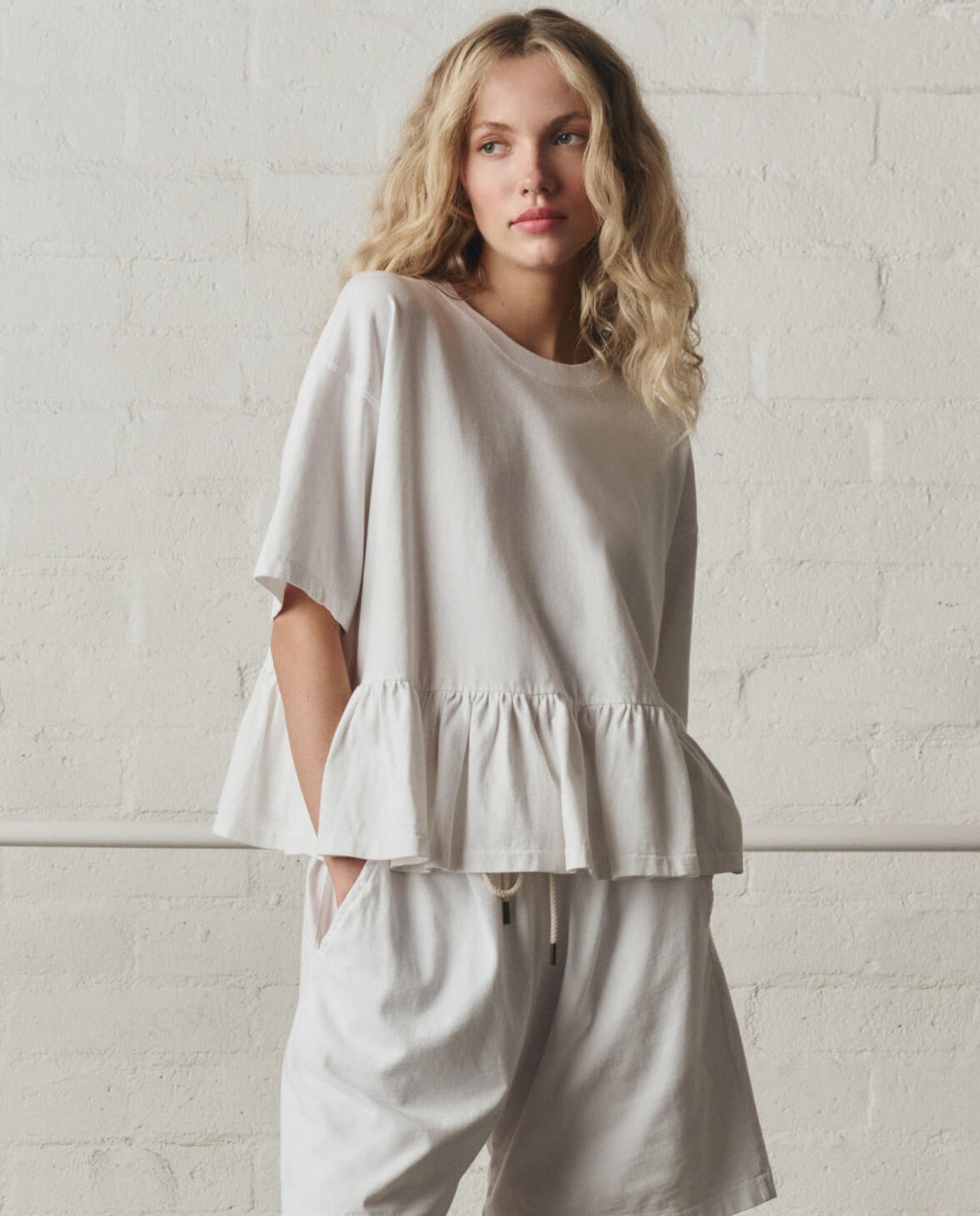 The Oversized Ruffle Peplum Tee. -- True White