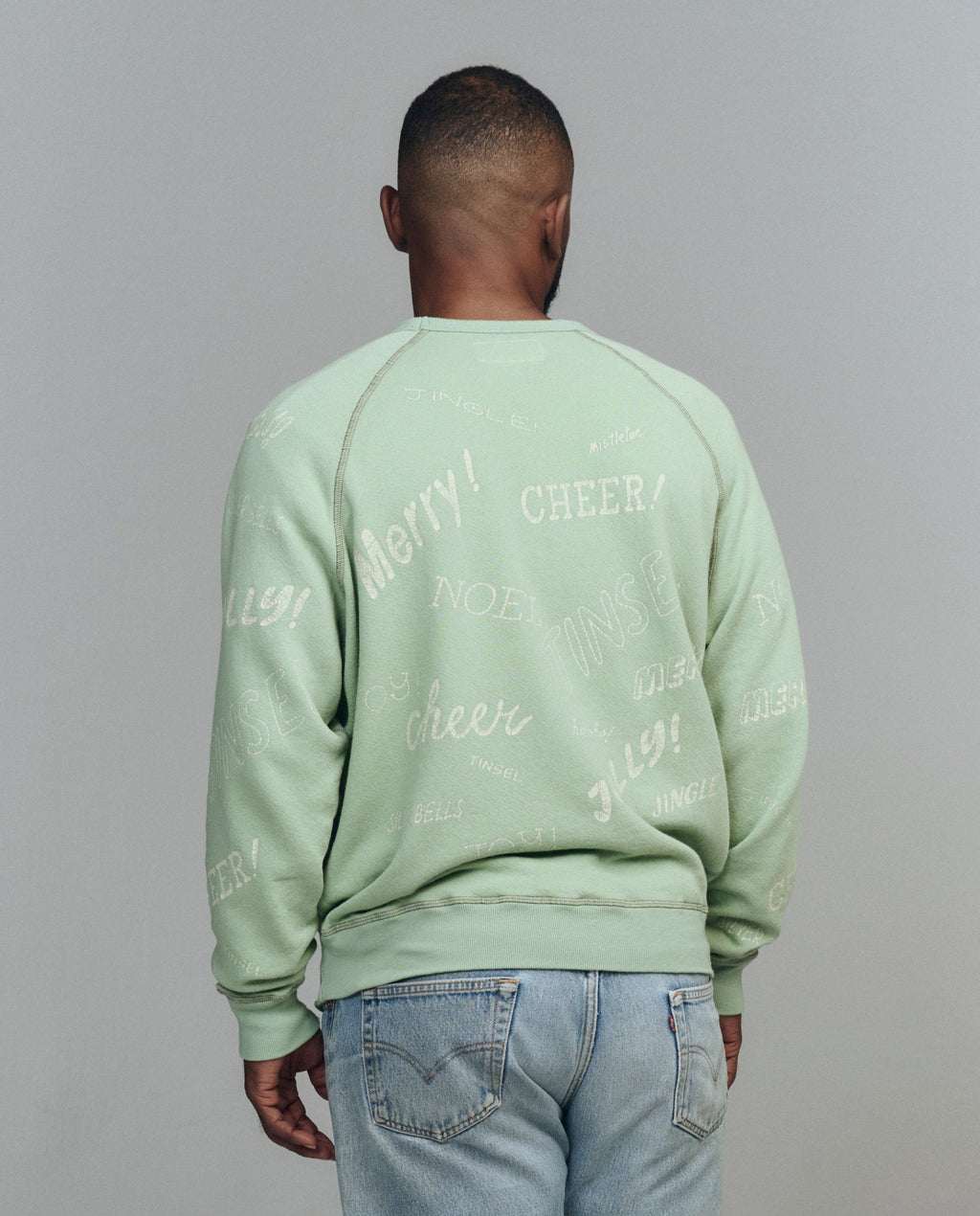 The Men's College Sweatshirt. Graphic -- Vintage Mint with Holiday Greetings Graphic