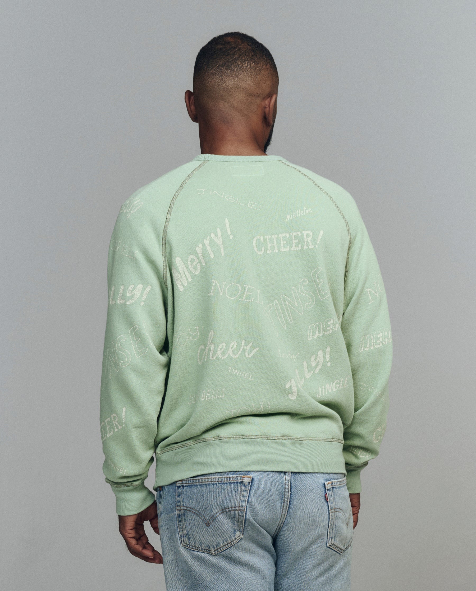 The Men's College Sweatshirt. Graphic -- Vintage Mint with Holiday Greetings Graphic