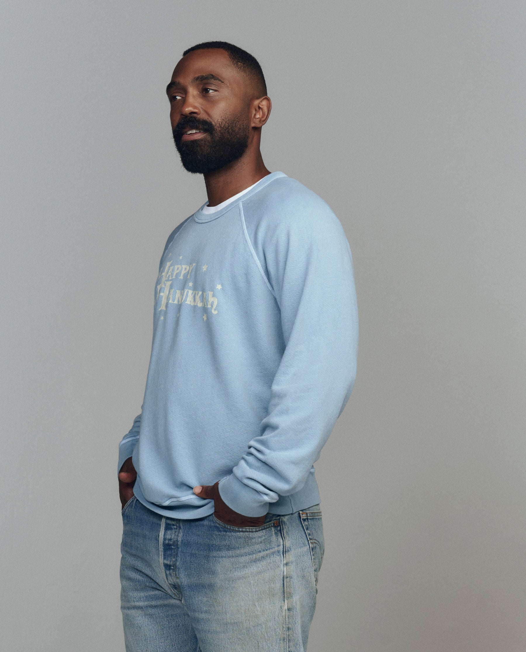 The Men's College Sweatshirt. Graphic -- Confection Blue with Happy Hannukah Graphic