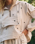The Embroidered Cropped Trailhead Pullover. -- Cream With Black Daisies