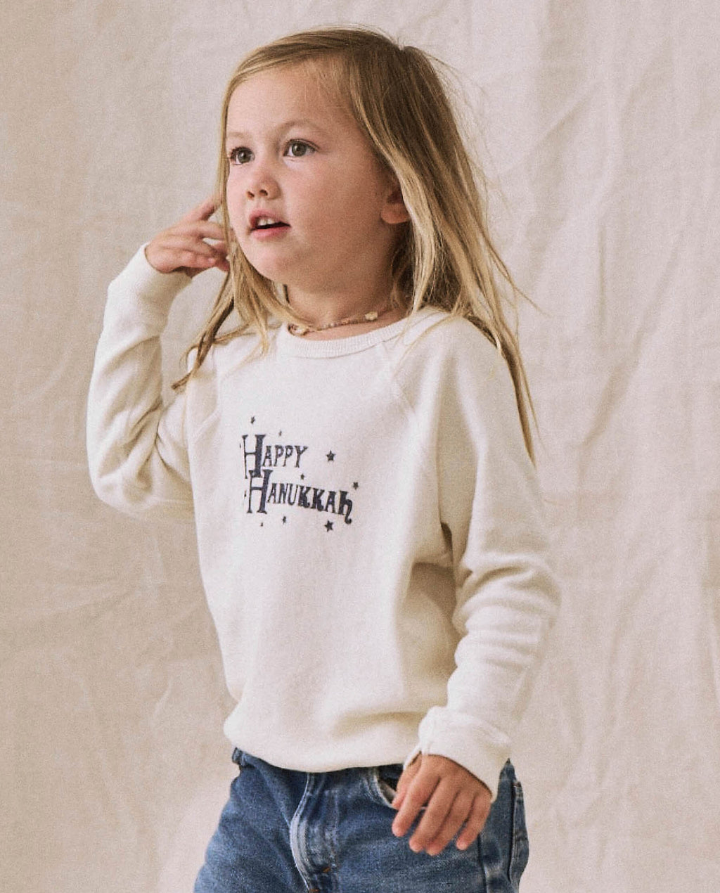 The Little College Sweatshirt. -- Washed White with Hanukkah Graphic