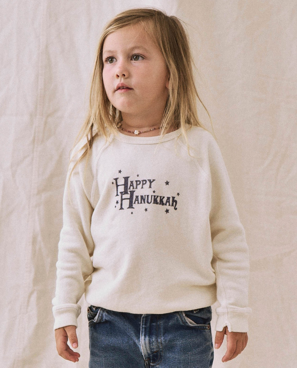 The Little College Sweatshirt. -- Washed White with Hanukkah Graphic