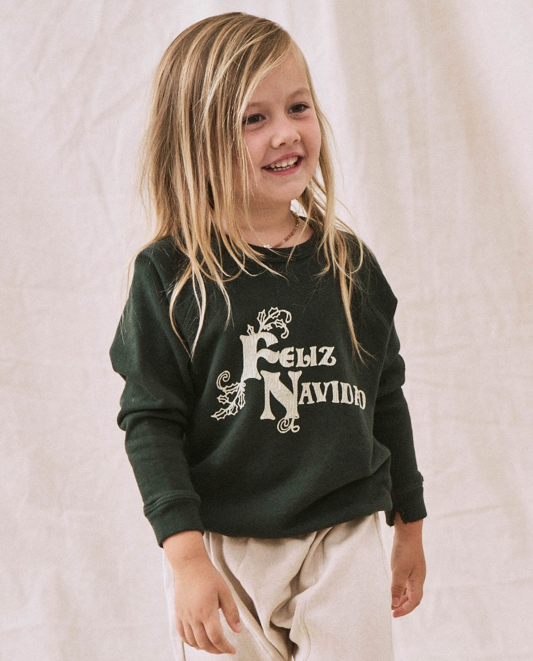 The Little College Sweatshirt. -- Dark Alpine with Feliz Navidad Graphic
