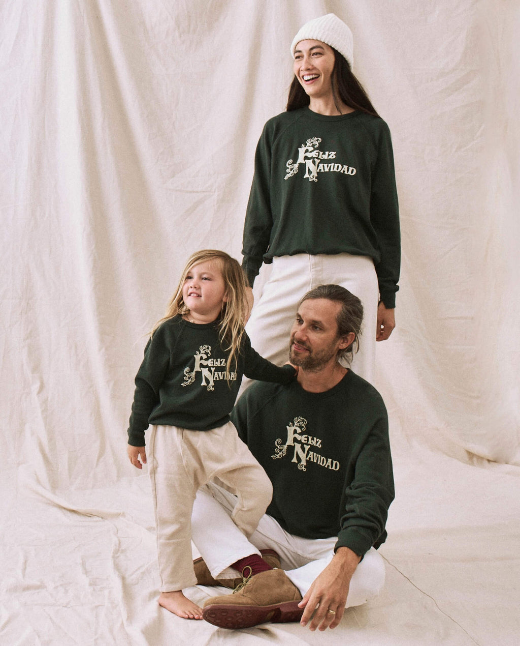 The Little College Sweatshirt. -- Dark Alpine with Feliz Navidad Graphic