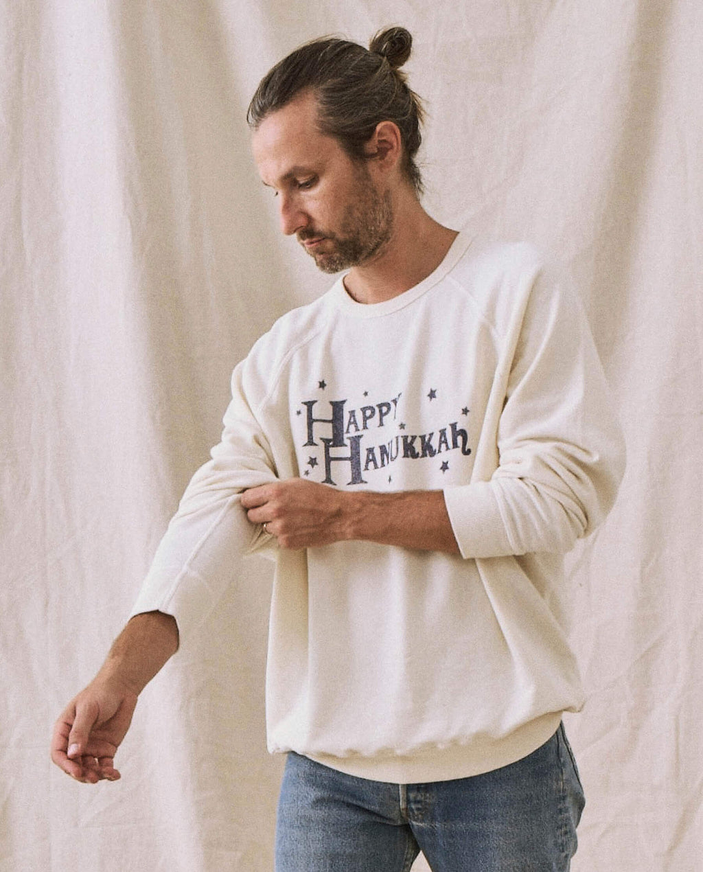 The Men's College Sweatshirt. -- Washed White with Hanukkah Graphic