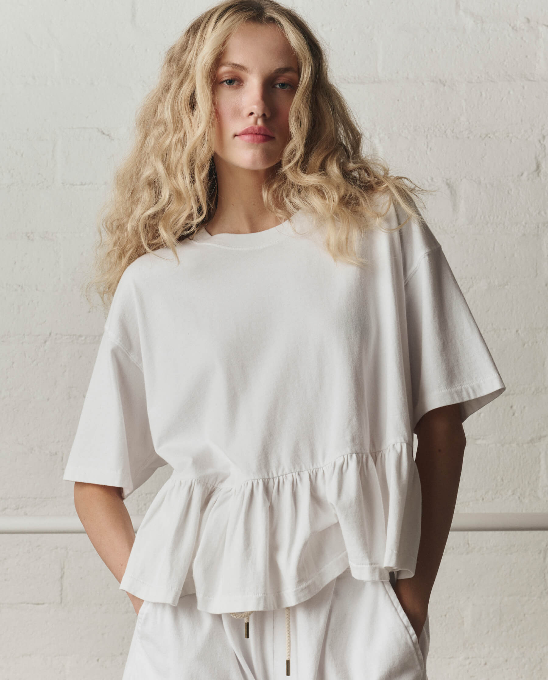 The Oversized Ruffle Peplum Tee. -- True White
