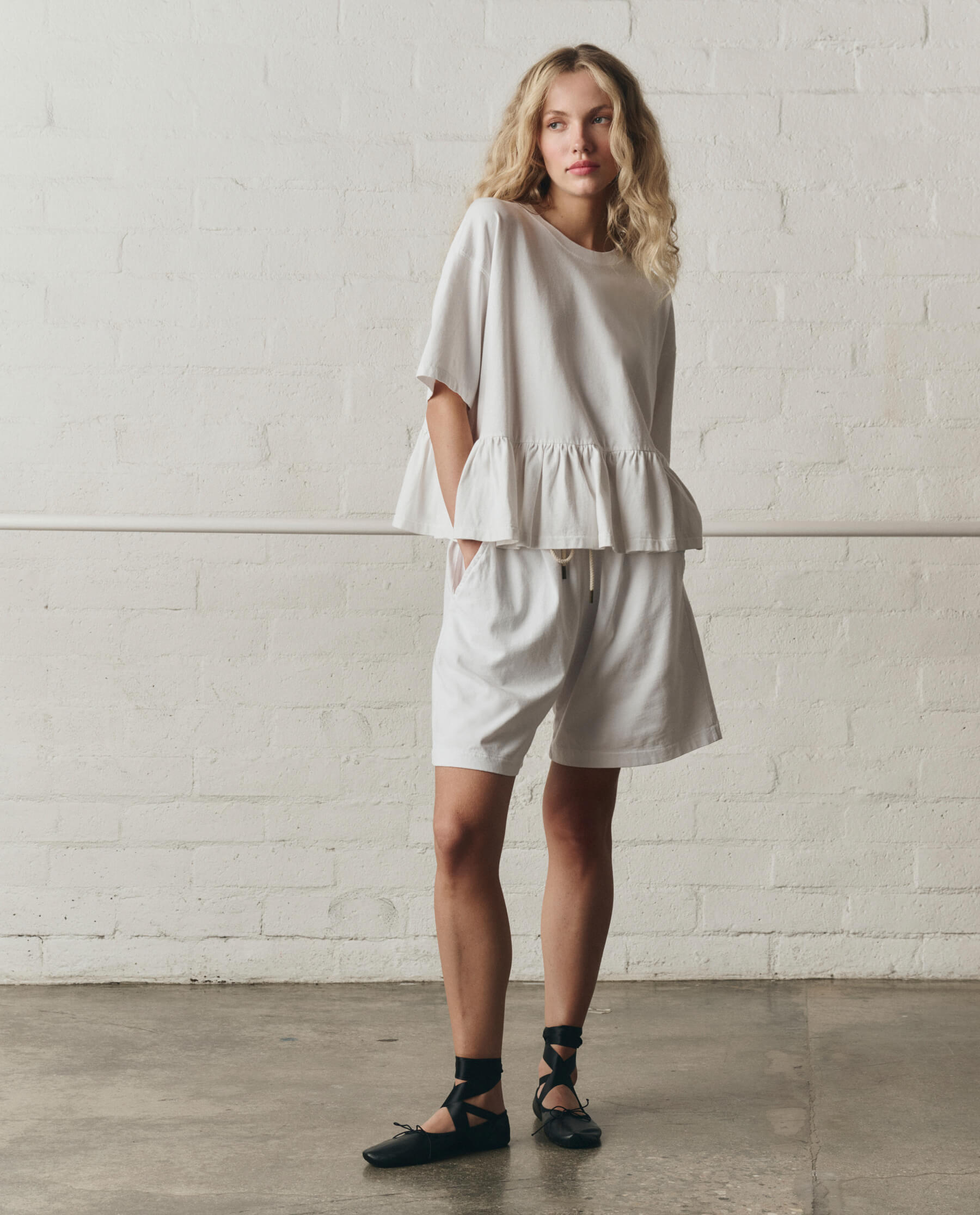 The Oversized Ruffle Peplum Tee. -- True White