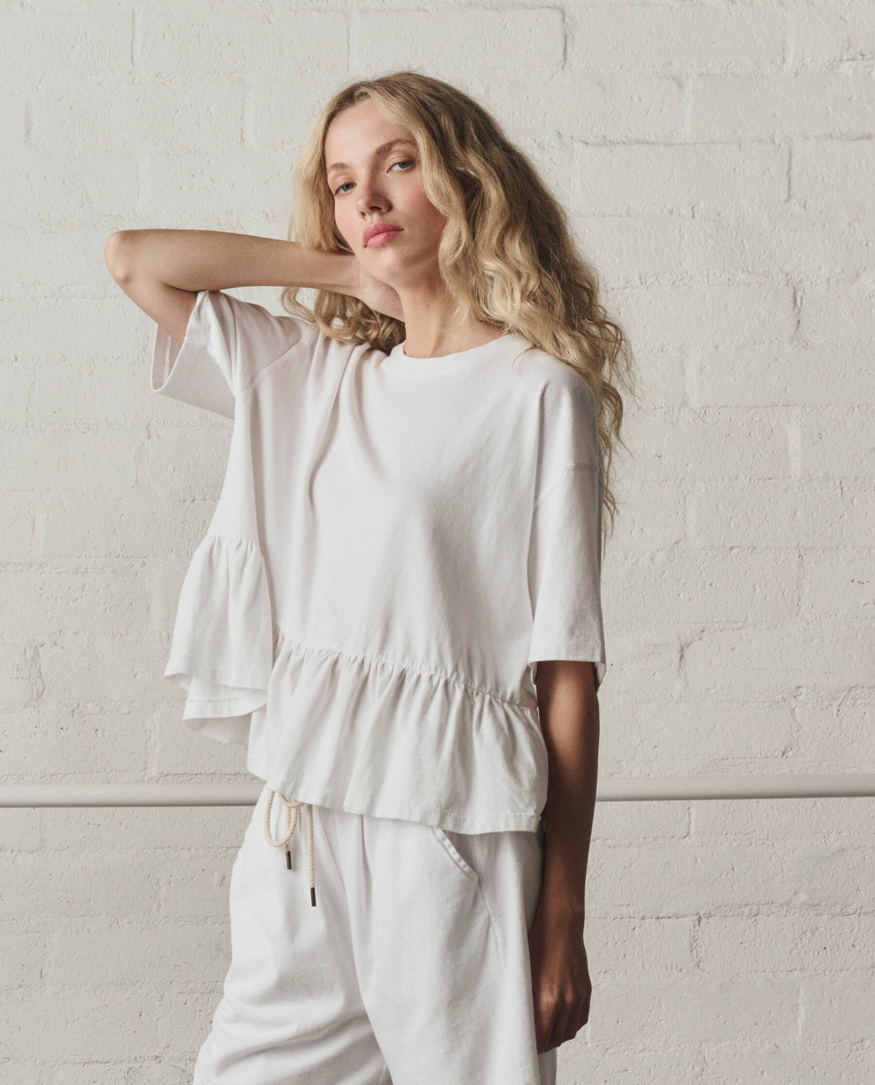 The Oversized Ruffle Peplum Tee. -- True White