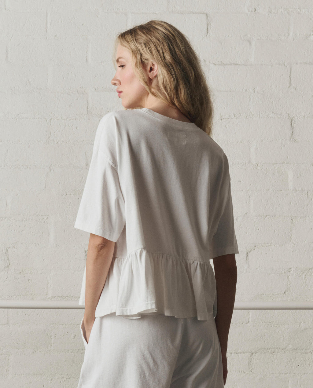 The Oversized Ruffle Peplum Tee. -- True White