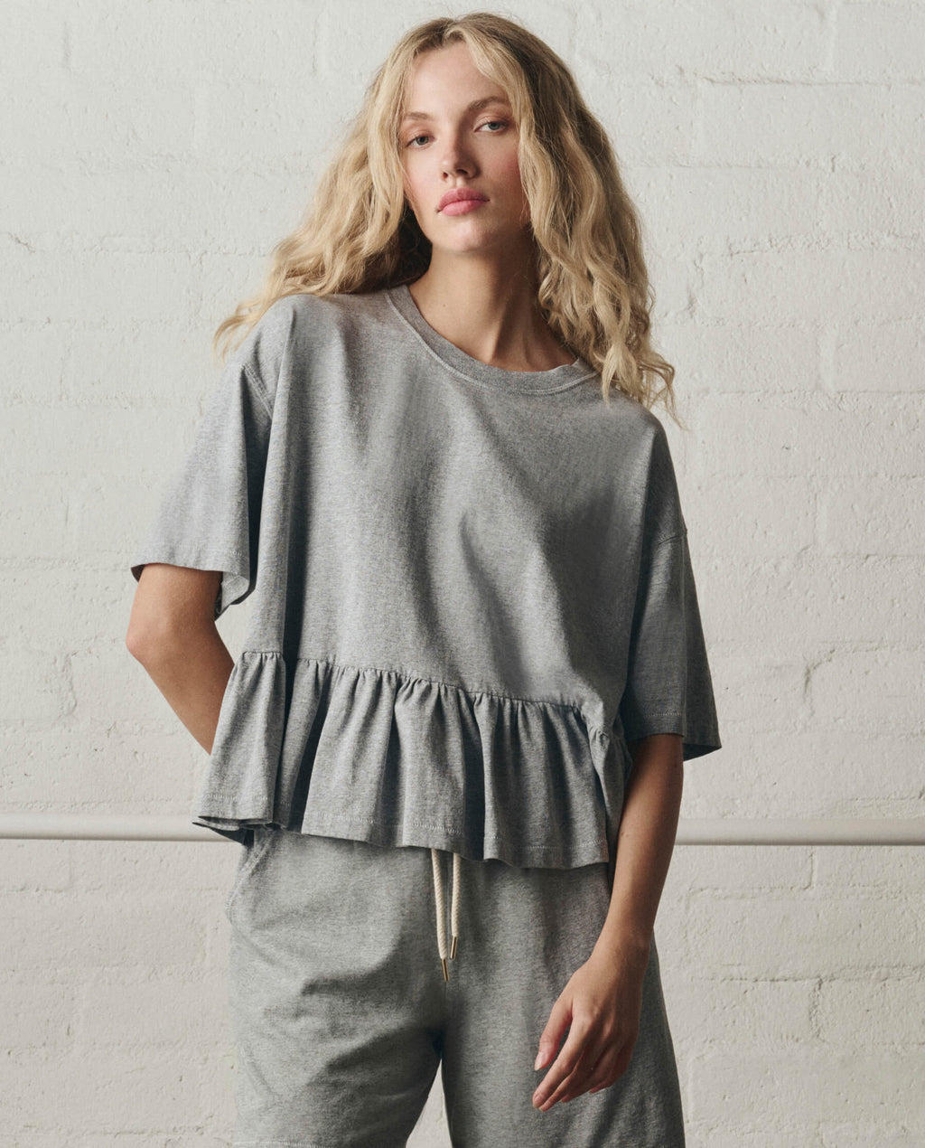 The Oversized Ruffle Peplum Tee. -- Heather Grey