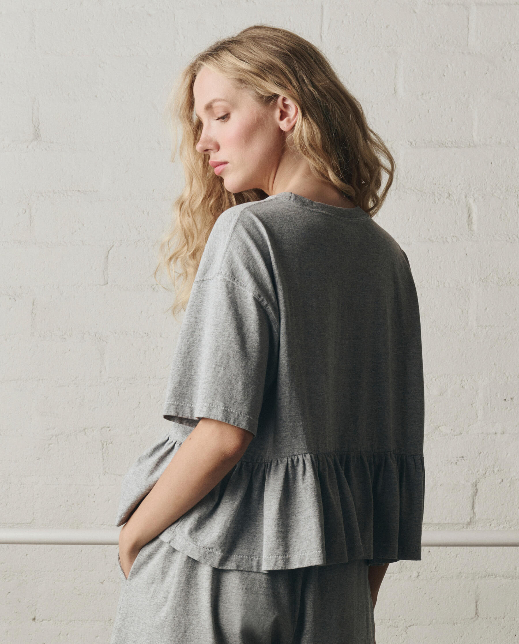 The Oversized Ruffle Peplum Tee. -- Heather Grey