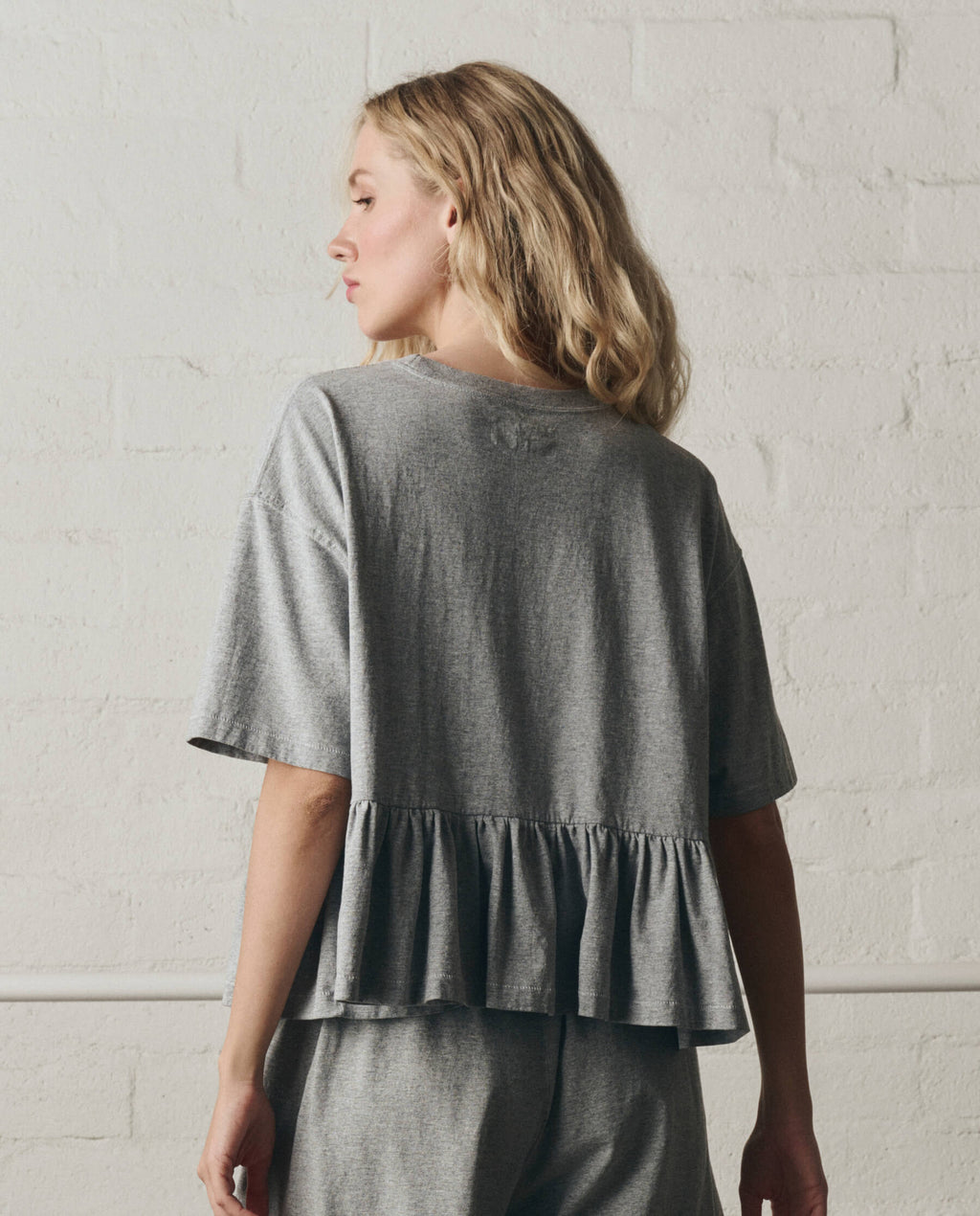 The Oversized Ruffle Peplum Tee. -- Heather Grey