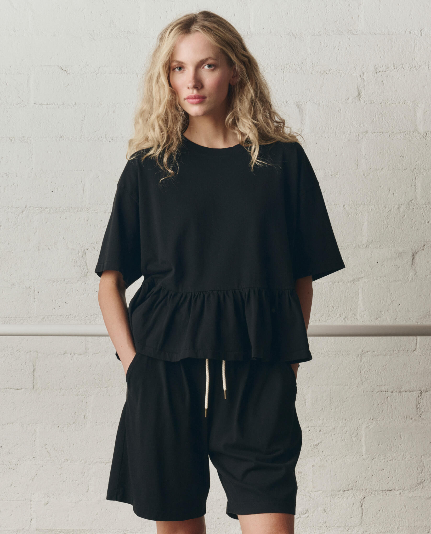 The Oversized Ruffle Peplum Tee. -- True Black